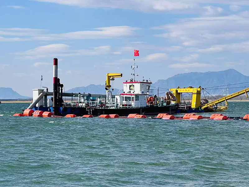 How Does a Tugboat Work Alongside a Dredger in Shallow Waters?